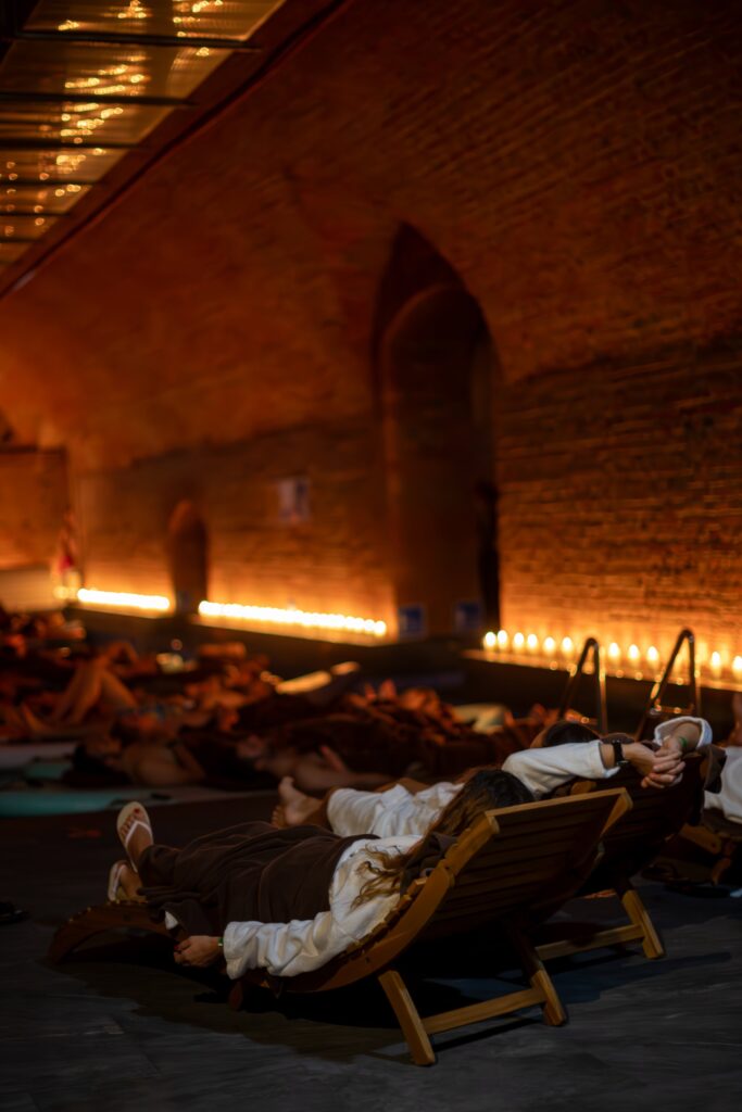 Concert participants lying on loungers by the pool